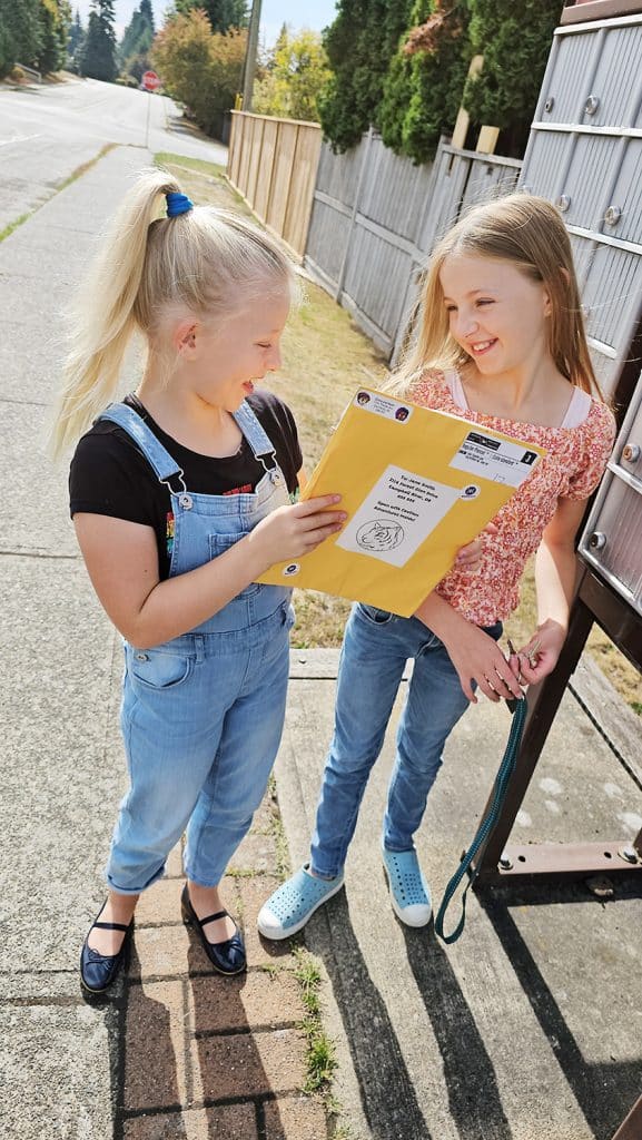 Kids receiving their Kaper Kit at the mailbox