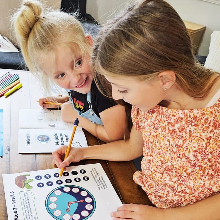 Two girls working on Kaper Kits