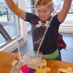 smiling girl showing slime